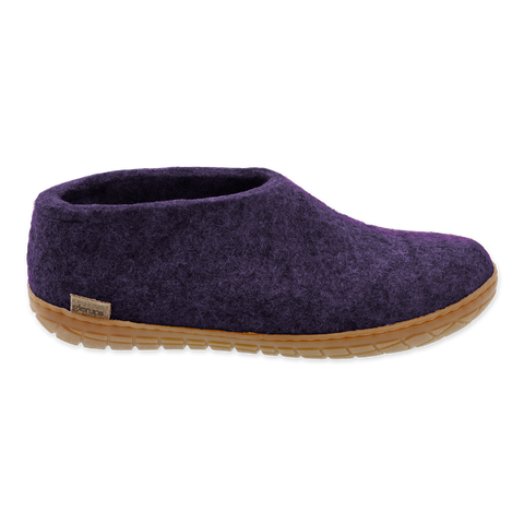 Purple slipper with a brown sole on a white background