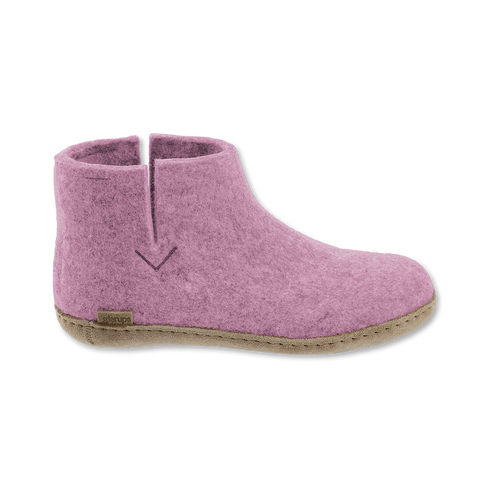 Pink felted boot on a white background