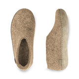 Pair of brown slippers on a white background