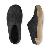 Pair of charcoal slippers on a white background