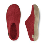 Red slippers with leather soles on a white background