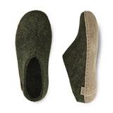 Pair of green slippers on a white background