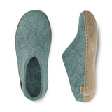 Pair of north sea slippers with leather soles on a white background
