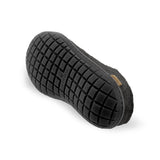 Black slipper with textured sole on a white background