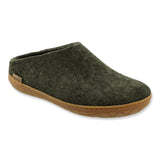 Green slip-on shoe with rubber sole on a white background