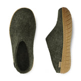 Pair of green slippers with rubber soles on a white background