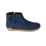 Blue ankle boot with brown sole on a white background