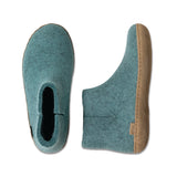 Teal felt shoe sole with brown heel on a white background
