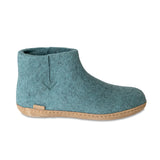 Teal ankle boot with cork sole on a white background