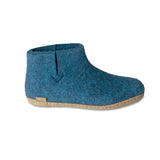 Blue felt ankle boot on a white background