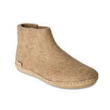 Beige ankle boot on a white background