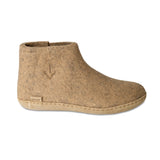Beige ankle boot on a white background