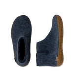 Pair of blue slippers with honey rubber soles on a white background