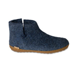 Blue ankle boot with honey rubber sole on a white background