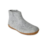 Gray ankle boot with honey rubber sole on a white background