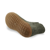 Bottom view of a Forrest green wool boot with a natural rubber sole on a white background