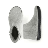 Pair of gray slippers on a white background