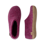 Cranberry slippers with a brown sole on a white background