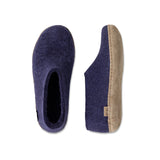Purple slipper with a beige sole on a white background