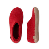 Red slippers with beige soles on a white background