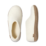 Pair of white slippers with brown soles on a white background