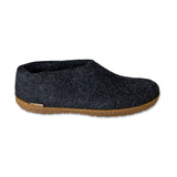 Dark gray slip-on shoe with honey rubber sole on a white background