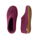 Pair of cranberry slippers with honey rubber soles on a white background
