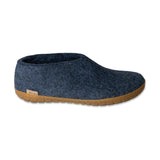 Blue slip-on shoe with honey rubber sole on a white background