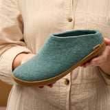 Person holding a north sea slipper with rubber sole