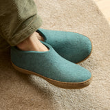 North Sea slippers worn indoors on a carpeted floor